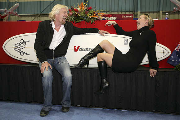 Richard Branson shares a laugh with Virgin Blue Public Relation Manager Amanda Bolger in Seattle, Washington.