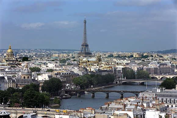A view of the Paris skyline, the Eiffel tower and the Seine River.