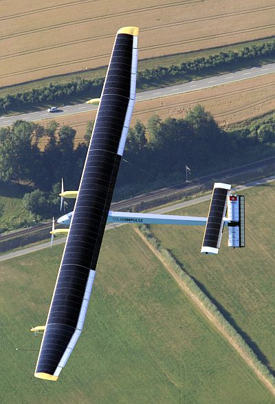 Solar Impulse's Chief Executive Officer and pilot Andre Borschberg flies in the solar-powered HB-SIA prototype airplane during its first successful night flight attempt at Payerne airport.