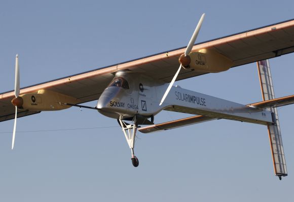 Solar Impulse's Chief Executive Officer and pilot Andre Borschberg performs a low altitude go-round procedure with the solar-powered HB-SIA prototype aircraft during a test flight at Payerne airport.