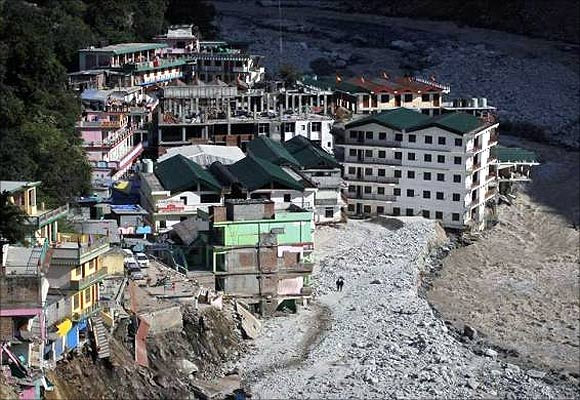 Buildings destroyed during floods are seen next to the Alaknanda river in Govindghat in the Himalayan state of Uttarakhand.