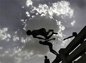 Boys jump into a canal during a hot day in New Delhi. Photograph: Anindito Mukherjee/Reuters