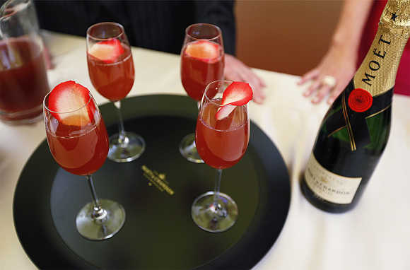 A tray of champagne cocktails rests on a table during a food and wine preview in preparation for the 84th Academy Awards in Hollywood, California.