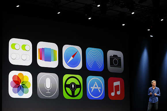New Apple iOS 7 features are displayed on screen during Apple Worldwide Developers Conference 2013 in San Francisco, California.