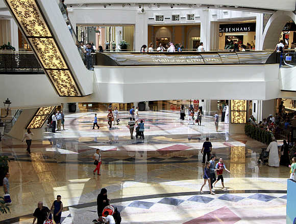 People shop at the Mall of the Emirates in Dubai, United Arab Emirates.