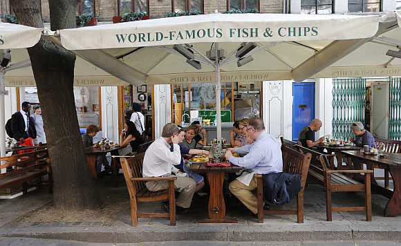 Diners eat at the Rock and Sole Plaice restaurant in central London.