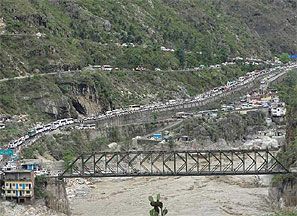 Stranded vehicles stand in queues after heavy rains in the Himalayan state of Uttarakhand. Photograph: Reuters