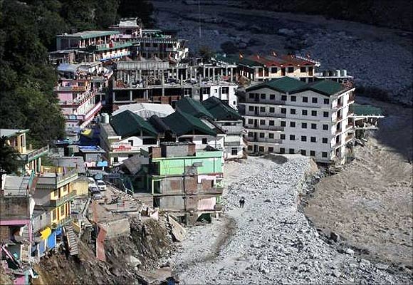 Buildings destroyed during floods are seen next to the Alaknanda river in Govindghat in the Himalayan state of Uttarakhand