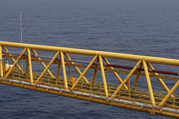 An employee walks on a bridge at the Mexico's state-run oil monopoly Pemex platform Ku Maloob Zaap in the Northeast Marine Region of Pemex Exploration and Production in the Bay of Campeche.