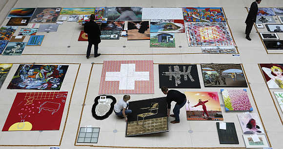 Staff arrange artworks submitted by people to the Deutsche Bank Kunsthalle art gallery for contemporary art in Berlin, Germany.