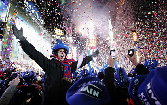 Revellers celebrate the new year in Times Square in New York City.