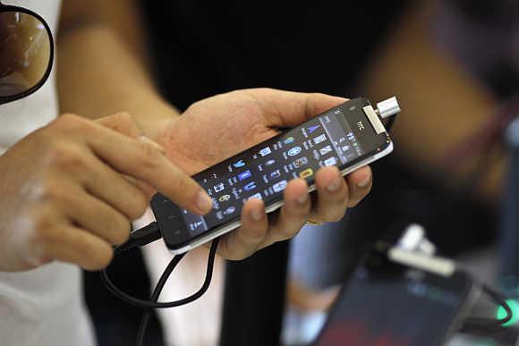 A man looks at a smartphone in Yangon, Myanmar.