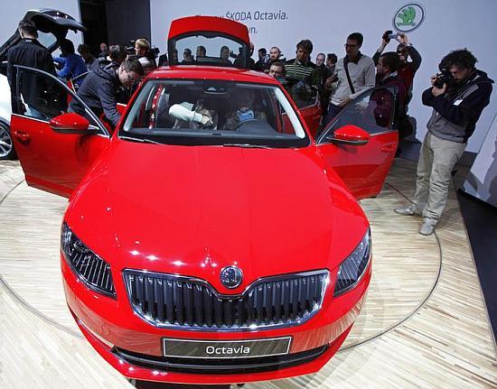 Visitors observe a new Skoda Octavia.