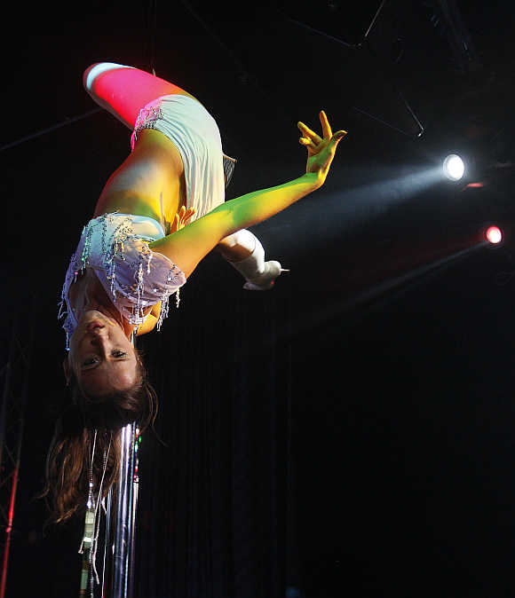 A woman performs a pole dancing routine during a competition in Singapore.
