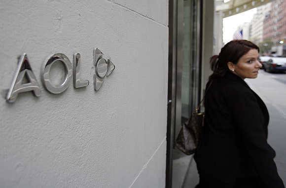 A woman walks out of AOL offices in New York City.
