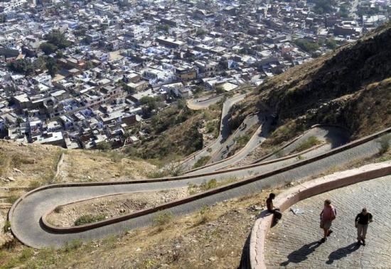Tourists walk on a pathway that leads to Nahargarh fort in Jaipur.