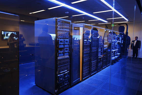 People peer into a server room during the opening of Hewlett-Packard's Executive Briefing Center in Palo Alto, California.