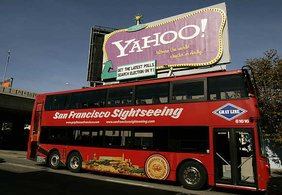 A tourist bus passes a Yahoo! sign in San Francisco, California.