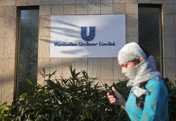 A pedestrian walks past the Hindustan Unilever Limited headquarters in Mumbai.