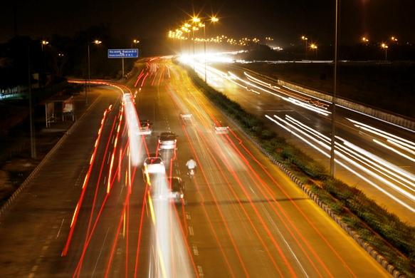 Vehicles drive on a road in New Delhi.