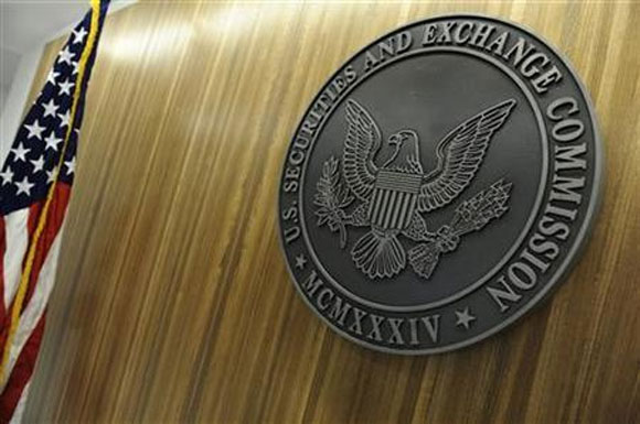 The seal of the US Securities and Exchange Commission hangs on the wall at SEC headquarters in Washington.