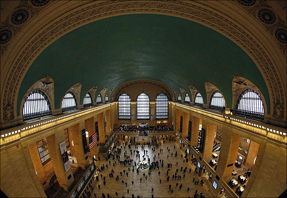 Commuters move through the grand hall of Grand Central Terminal in New York.