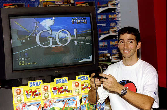 Top British Formula One racing driver Damon Hill tries out Sega's 'Virtual Racing' video game.