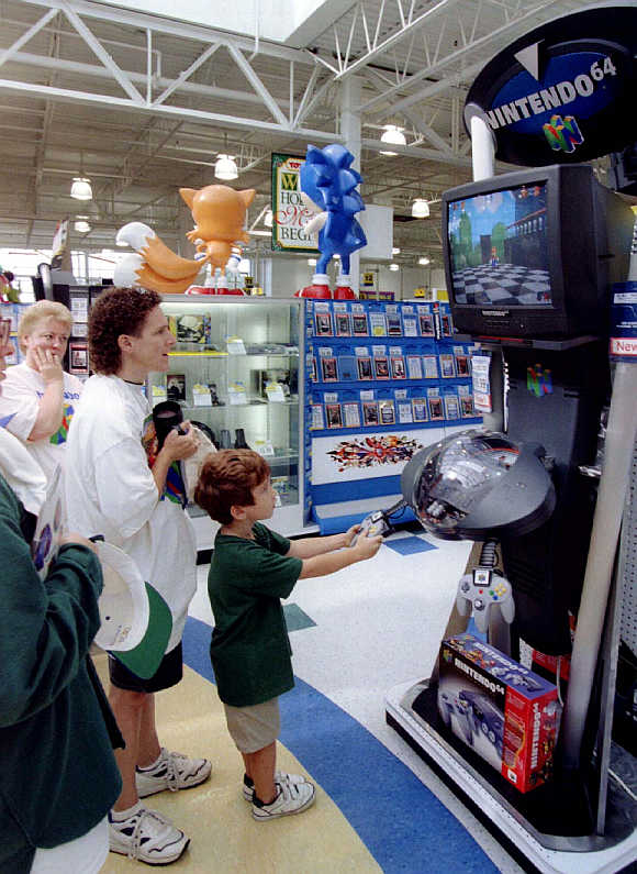 A youngster tries Nintendo video game player in Raritan, New Jersey, United States.