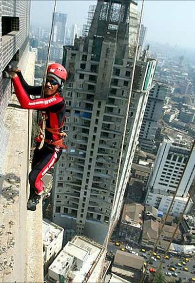 Gaurav Sharma, a martial arts trainer, climbs the 45 storey 'Shreepati Arcade' in Mumbai.