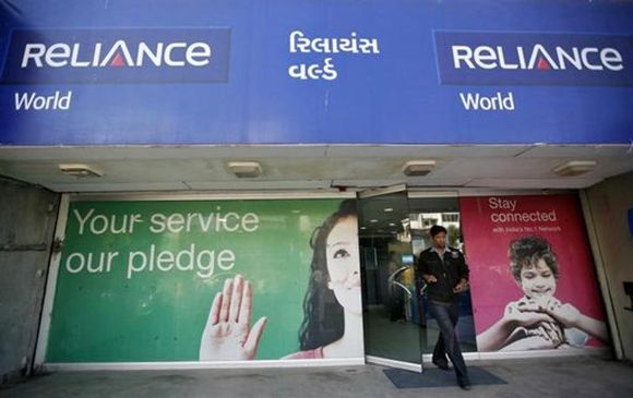 A customer leaves a Reliance communication store.