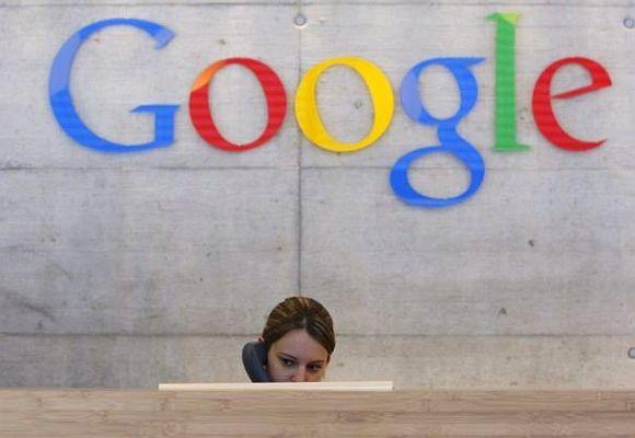 An employee answers phone calls at the switchboard of the Google office.