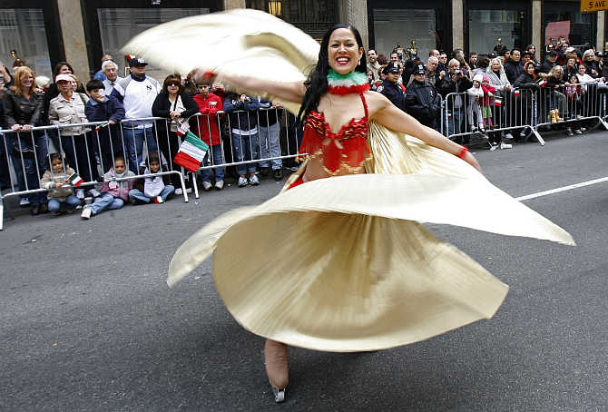 A woman takes part in the annual Columbus Day Parade up Fifth Avenue in New York City, United States.