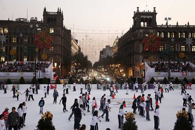 Ice skaters on a rink in Mexico City's historic Zocalo square, Mexico.