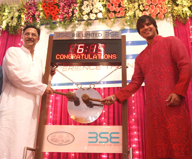Suresh and Vivek Oberoi ring the opening bell of mahurat trading.