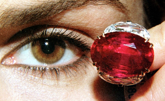 A model displays the 'Pink Star' 59.60 carat oval cut pink diamond at Sotheby's in Geneva.