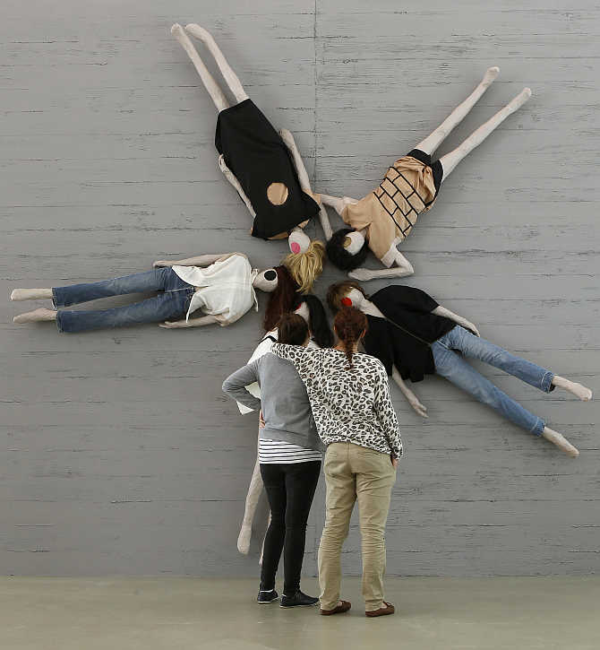 Visitors stand in front of the installation 'A Uniform Sample' by Swiss artist Mai-Thu Perret at the Aargauer Kunsthaus art museum in Aarau west of Zurich, Switzerland.