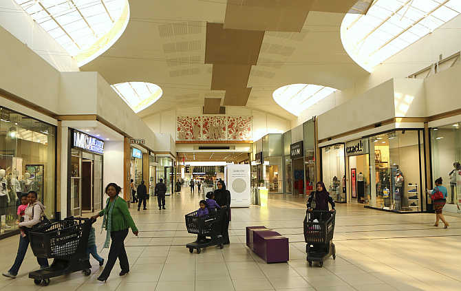 Shoppers push trolleys at a mall in Lenasia, south of Johannesburg, South Africa.
