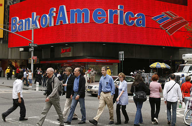 Pedestrians walk past a Bank of America branch in New York.