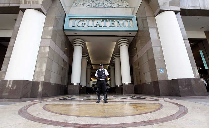 A security guard stands at the entrance of the Iguatemi Mall in Sao Paulo, Brazil.