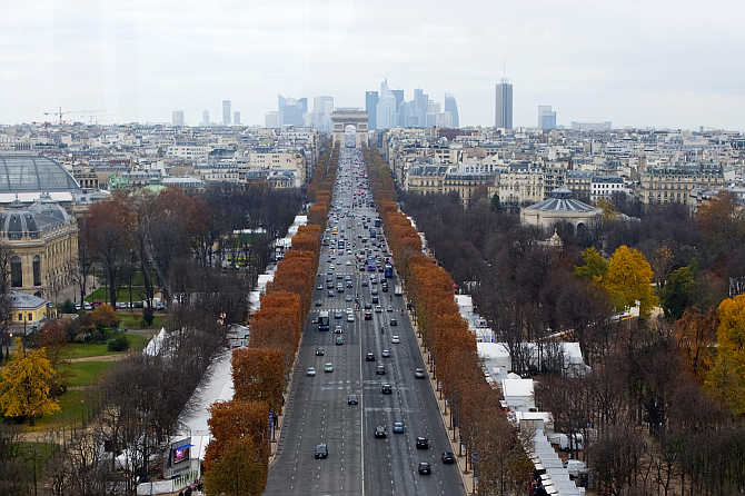 A view of the Champs Elysees Avenue and the Arc de Triomphe monument in Paris, France.