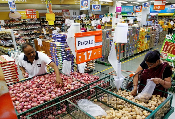 Customers shop inside a food superstore in Ahmedabad.