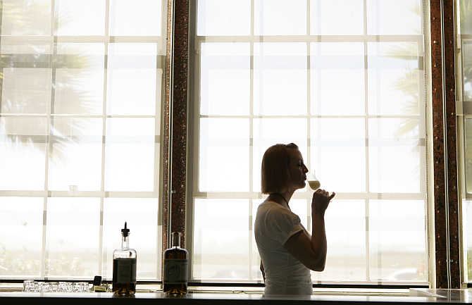 Erin Hall sips St George Spirits's Absinthe Verte in the tasting room in Alameda, California.