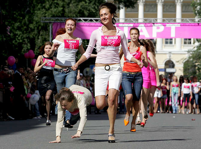 Women compete in a high-heel sprint in St Petersburg, Russia.