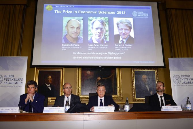Members of the Royal Swedish Academy of Sciences Torsten Persson (L-R), Per Krusell, Staffan Normark and Per Stromberg announce the winners of the Nobel Prize in Economics, officially called the Sveriges Riksbank Prize in Economic Sciences in Memory of Alfred Nobel, during a news conference at the Royal Swedish Academy of Sciences in Stockholm.