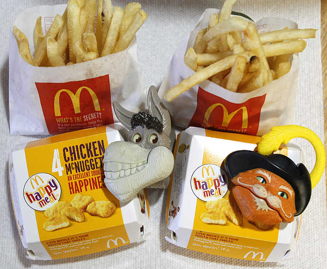 Two McDonald's Happy Meal with toy watches fashioned after the characters Donkey and Puss in Boots from the movie 'Shrek Forever After' are pictured in Los Angeles.