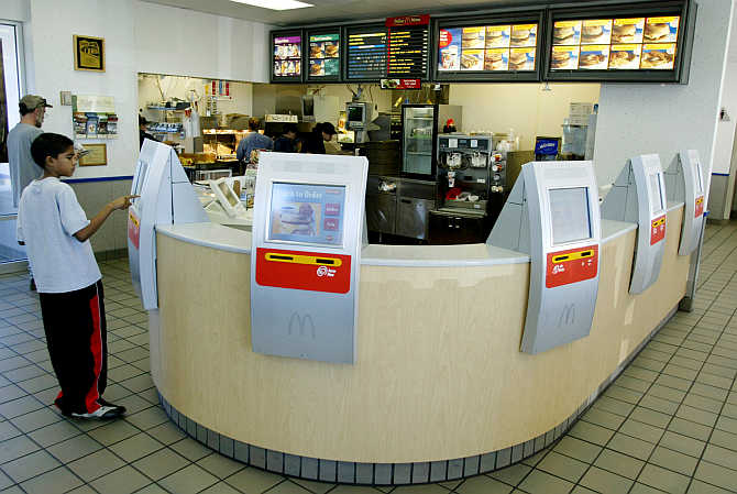 Computer terminals called kiosks line the counter at a McDonald's restaurant in the Denver suburb of Littleton, Colorado.