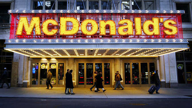 People pass a McDonald's restaurant on 42nd Street in Times Square in New York City.