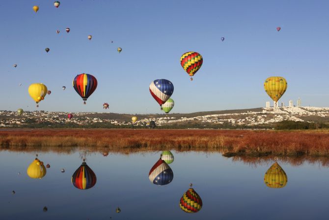 Hot air balloons fly over Metropolitano park during the International Hot-Air Balloon Festival in Leon, in the Mexican state of Guanajuato.
