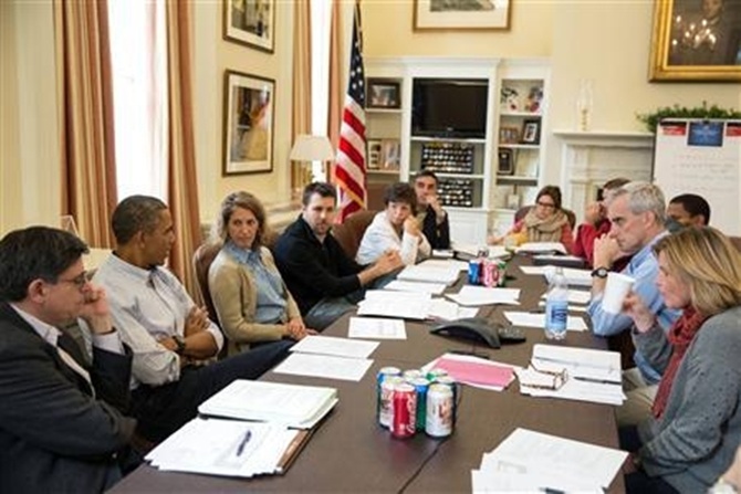 US President Barack Obama meeting with senior staff in the West Wing of the White House.