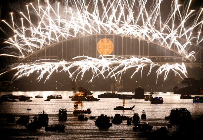 Fireworks explode over the Sydney Harbour Bridge.